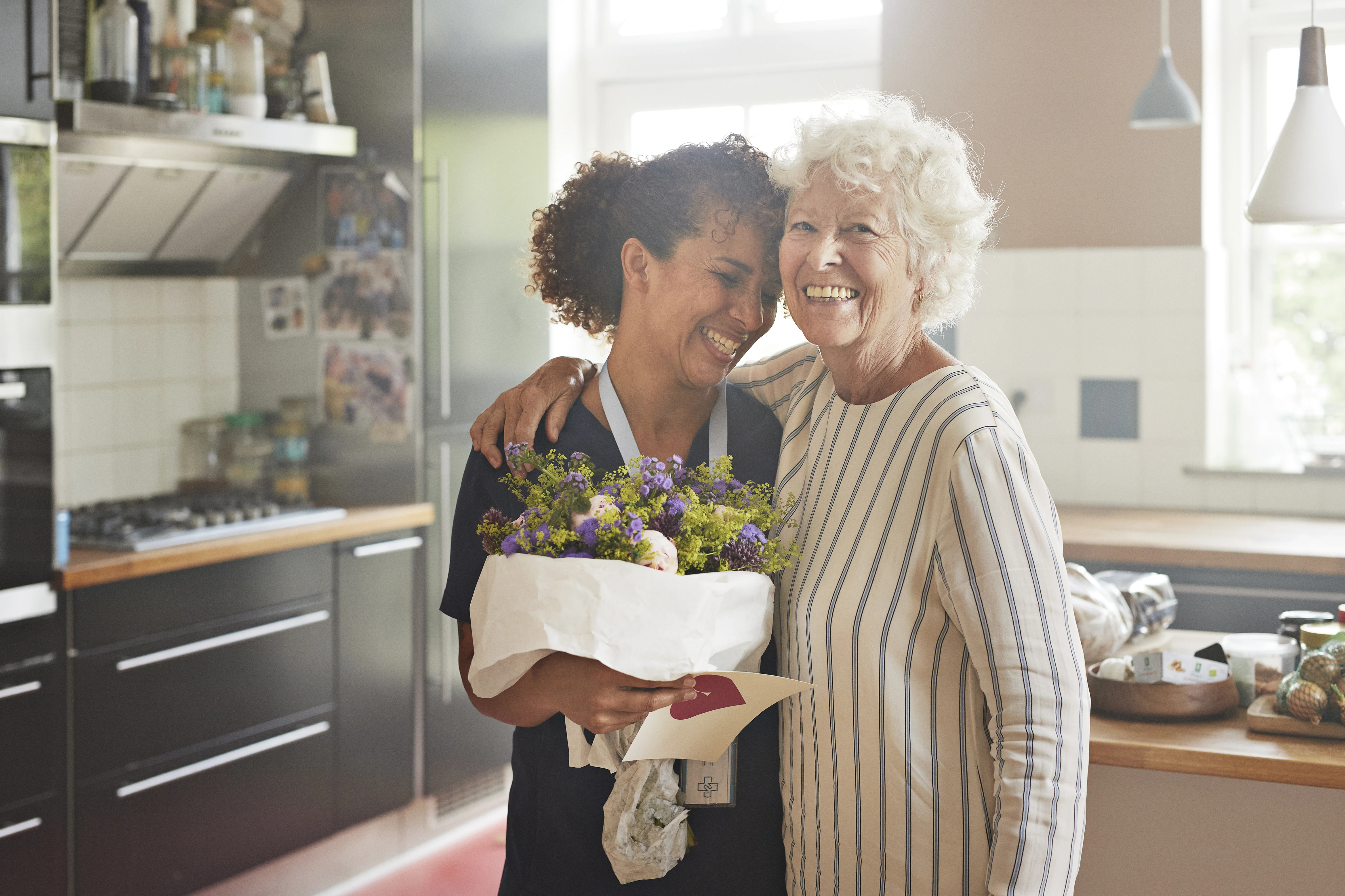 Nurse and patient hugging