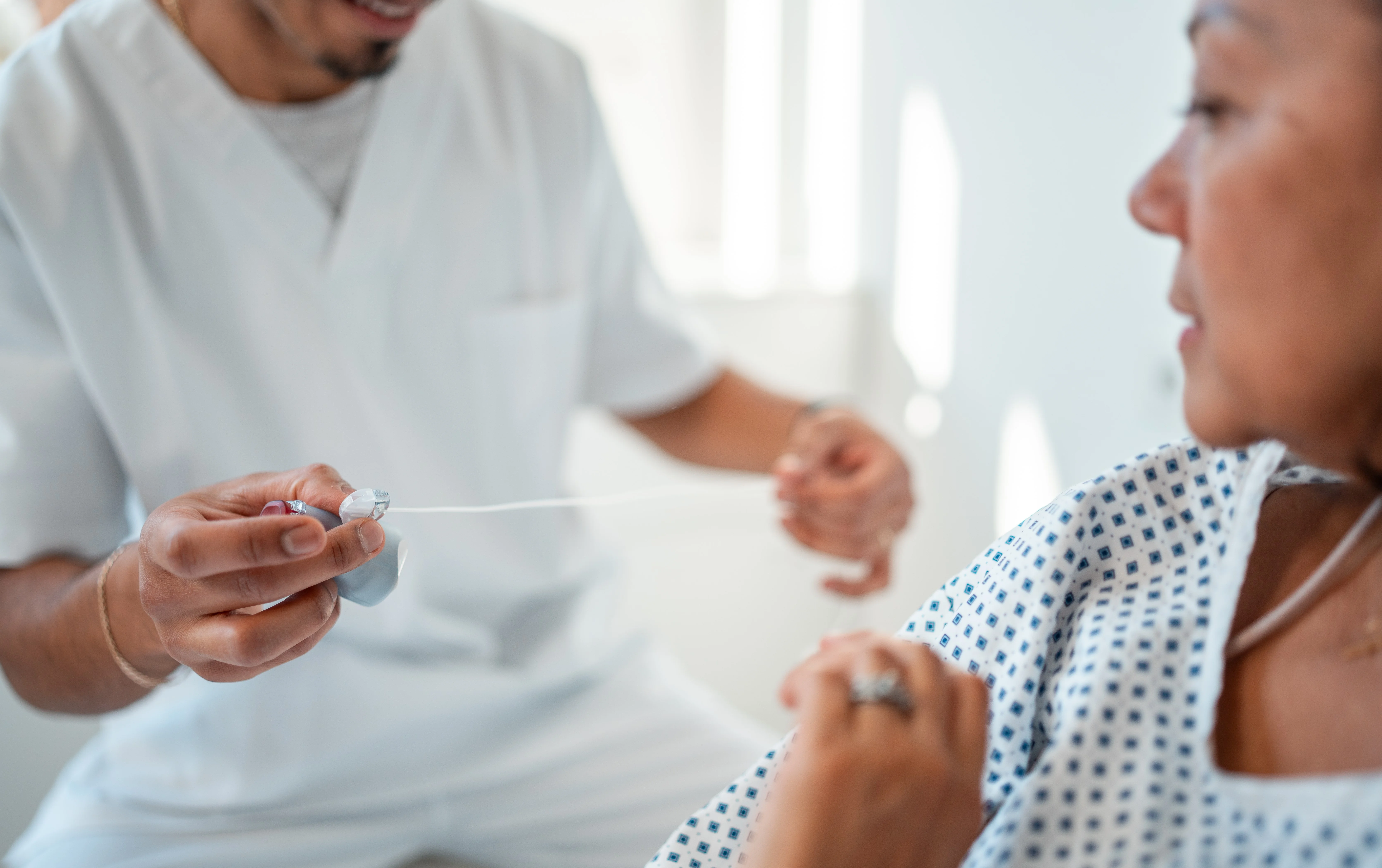 a doctor checking a patient's blood pressure